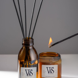 Rustic reed diffuser and soy wax candle with a lite match.